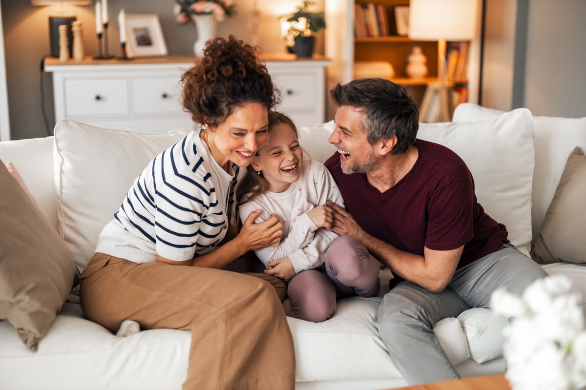 Family enjoying free time together at home laughing